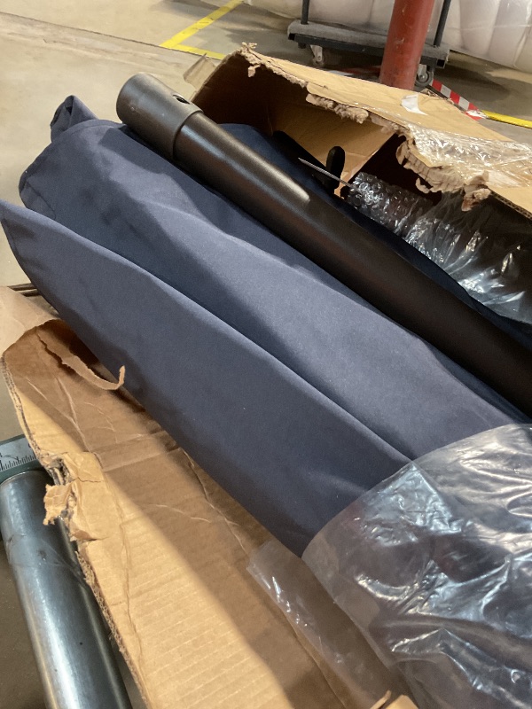 Photo 1 of **NO BASE PIECE**Outdoor dark blue umbrella, and pole 