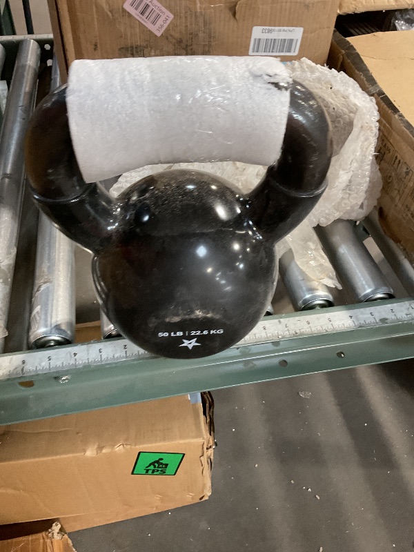 Photo 1 of 50 pound kettle bell PVC rubber base