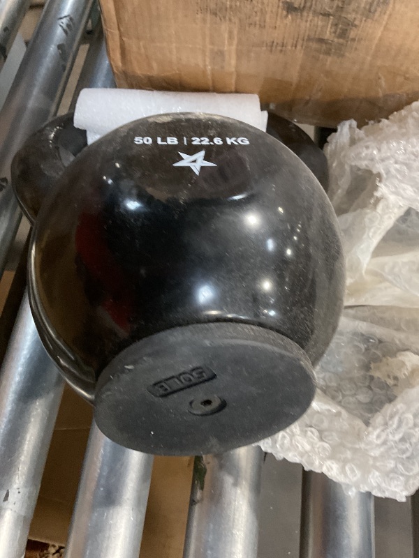 Photo 1 of 50 pound kettle bell PVC rubber base