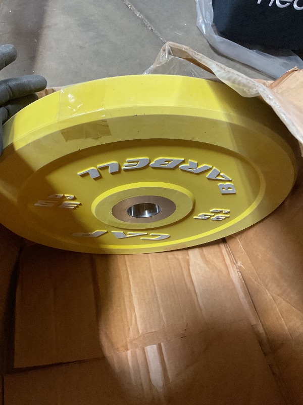 Photo 1 of 35 pound yellow cap barbell