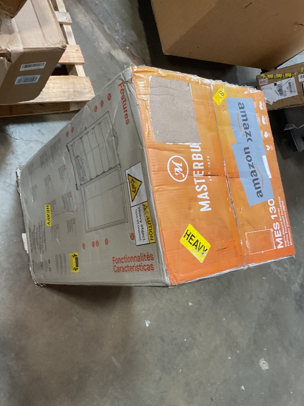 Photo 1 of **MISSING PARTS** Masterbuilt® 30-inch Digital Electric Vertical BBQ Smoker with Side Wood Chip Loader, Chrome Racks and 710 Cooking Square Inches in Black, Model MB20071117