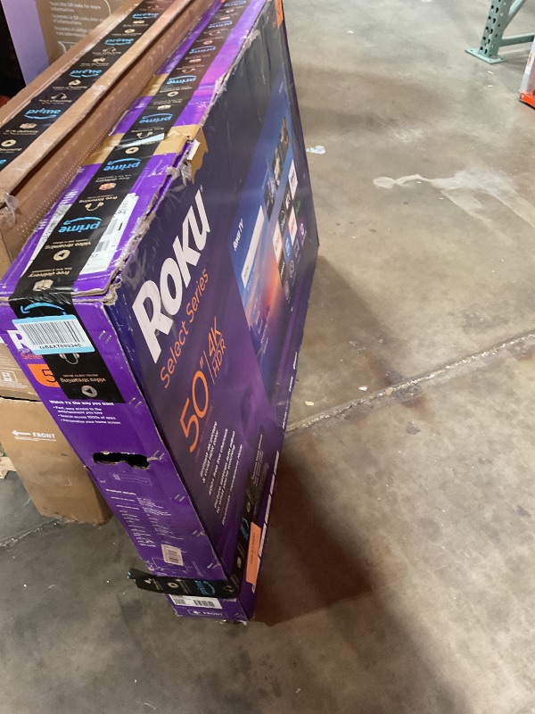 Photo 1 of **MAJOR DAMAGE. SELLING FOR PARTS**Roku Smart TV 2025 – 50-Inch Select Series, 4K HDR TV – RokuTV with Enhanced Voice Remote – Flat Screen LED Television with Wi-Fi for Streaming Live Local News, Sports, Family Entertainment