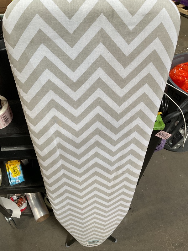 Photo 1 of Amazon Basics Full-Size Ironing Board - 4-Leg Fold-Up, Chevron Removable Cover, 60"L x 14"W x 38"H