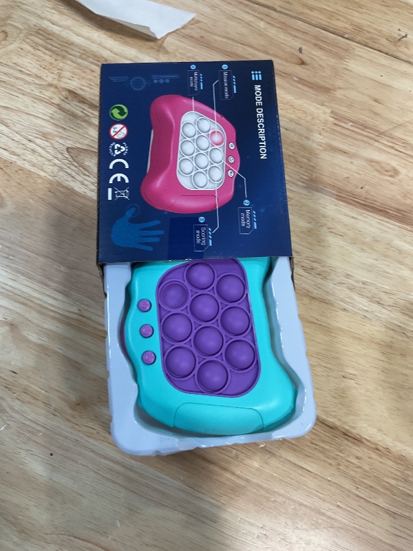 Photo 1 of **POSSIBLY FOR PARTS/ UNTESTED*** AOTIBO Fast Push Machine Light Up Fidget Toys for Kids Adults, Handheld Game for Kids 3-12, Quick Push Bubble Stress Toy, Sensory Toys Travel Games, Xmas Birthday Gifts for Boys Girls (Blue - Purple)