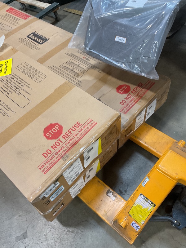Photo 1 of **4 PACKAGES TOTAL. SCRAPES ON SLIDE. BLACK FRAMING, WOOD DAMAGE **Backyard Discovery Whispering Point Light Gray Cedar Wood Swing Set with Wave Slide, Clubhouse, Crows Nest, Play Kitchen, Belt Swings, Web Swing, Rock Wall, Playhouse, Ladder, Windows, Out
