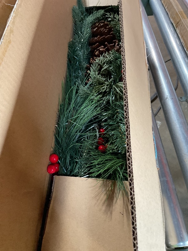Photo 1 of ***MEASUREMENTS ARE WRONG FOR HOW LONG NOT 9 FT*** National Tree Company 9 ft Pre-Lit Crestwood Spruce Artificial Christmas Garland, Christmas Decoration with Glitter, Pinecones, Red Berries, 50 Clear Lights, 180 Tips, Green