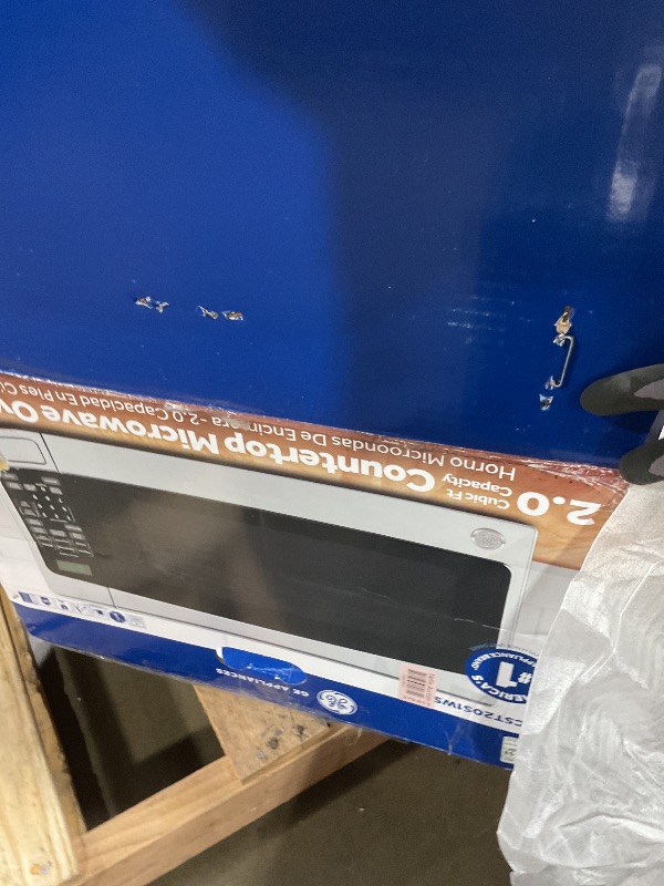 Photo 1 of **SELLING FOR PARTS. DOOR DOES NOT OPEN**GE Countertop Microwave Oven,1, 200-watt Capacity, 2.0 Cubic Ft., 8 Auto Setting Cooking Settings, Child-Lock Technology, Kitchen Essentials for the Countertop, Dorm Room or Apartment, Stainless Steel
