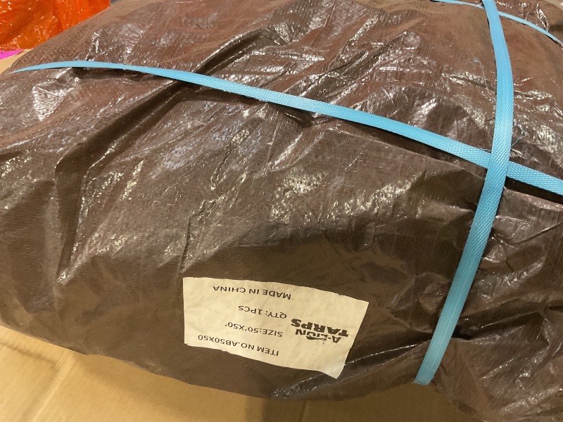 View 3 of **DIRT**50'x50' Heavy Duty Tarp, 10 Mil Thick, Waterproof, Tear & Fade Resistant, High Durability, UV Treated, Grommets Every 36 Inches. (Silver/Brown - Reversible)