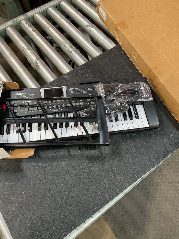 Photo 1 of 61 key piano keyboard?keyboards piano with Built-In Speaker Microphone, Sheet Music Stand and Power Supply, Portable Electronic Keyboard Piano for Beginners