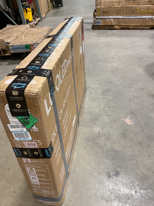 Photo 1 of **SELLING FOR PARTS. MAJOR DAMAGE TO SCREEN. MISSING REMOTE**. LG 55-Inch Class OLED evo AI 4K C5 Series Smart TV w/Dolby Atmos, Dolby Vision, HDR10, AI Super Upscaling 4K, Filmmaker Mode, Wow Orchestra, Alexa Built-in (OLED55C5PUA, 2025)