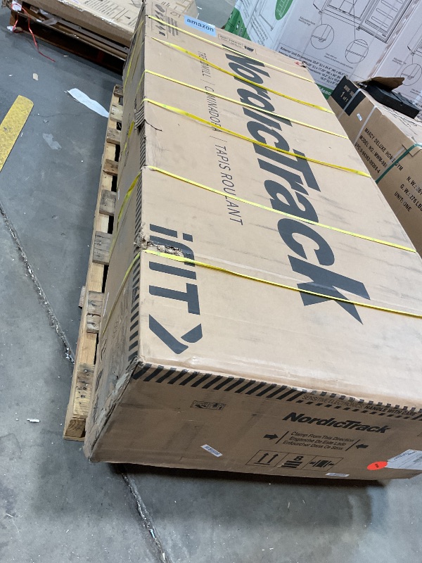 Photo 1 of **PLASTIC COVER IS CRACKED**NordicTrack Commercial 2450 Treadmill with iFIT