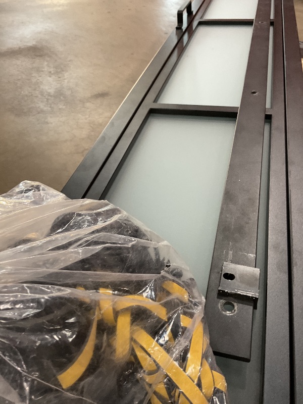 Photo 1 of **MINOR USE WEAR**Calhome 48 in. x 84 in. 3/4 Lites Frosted Glass Black Steel Frame Double Bi-Fold Barn Doors with Hardware Kit and Door Handle