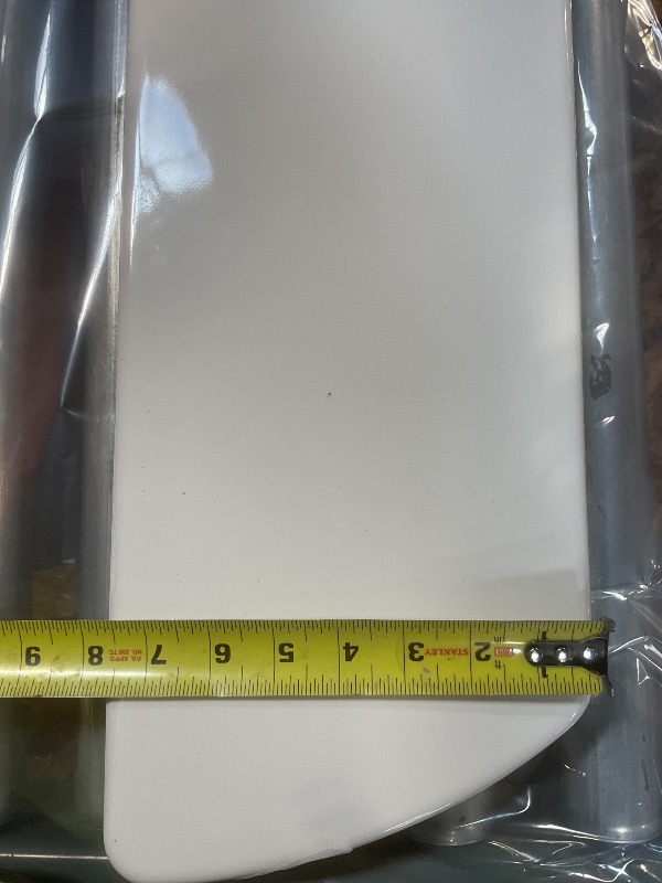 Photo 1 of **DIRT. SMALL CHIP**Toilet lid
