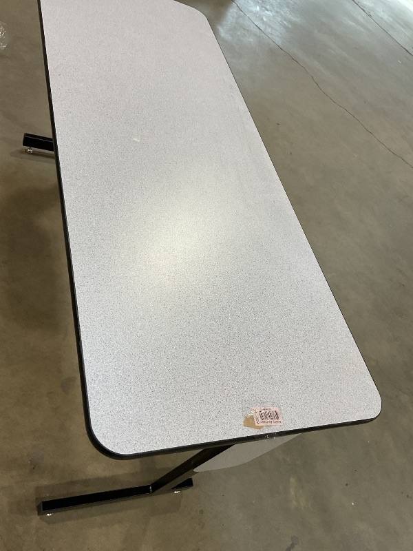 Photo 1 of **LEG HOLDER COMING LOOSE**DENT. SCRAPES AND SCRATCH FROM TRANSPORT **Correll 24" x 60" Gray Granite Thermal-Fused Laminate Top Folding Seminar Table with Panel Legs