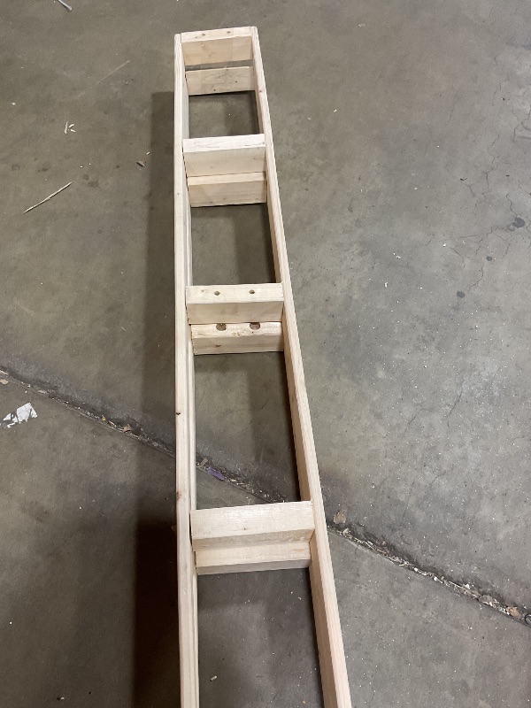 Photo 1 of **CHIPPED**Wood frames with drill holes. Curved ends