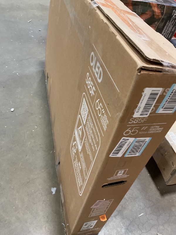 Photo 1 of **DIRT. BOTTOM OF FRAME UNDER TV LOOSE**Samsung 65-Inch Class OLED 4K S85F Series, Vision AI Smart TV (2025 Model, 65S85F) Object Tracking Sound Lite w/Dolby Atmos, NQ4 AI Gen2 Processor, Contour Design, Color Booster Pro, Alexa Built-in