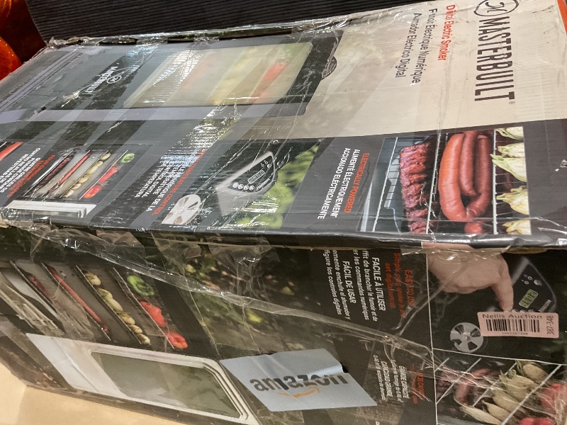 Photo 1 of **DIRT. DENTS. DOOR IS LOOSE**Masterbuilt® 30-inch Digital Electric Vertical BBQ Smoker with Leg Kit, Side Wood Chip Loader and 710 Cooking Square Inches in Black, Model MB20070421