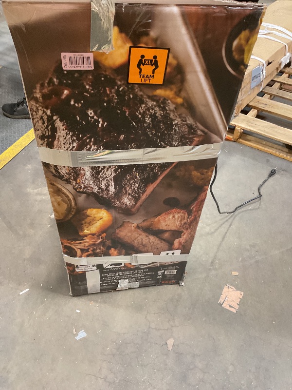 Photo 1 of **SCRAPES. DIRT. DENTS**Masterbuilt® 40-inch Digital Electric Vertical BBQ Smoker with Leg Kit, Side Wood Chip Loader and 970 Cooking Square Inches in Black, Model MB20070122