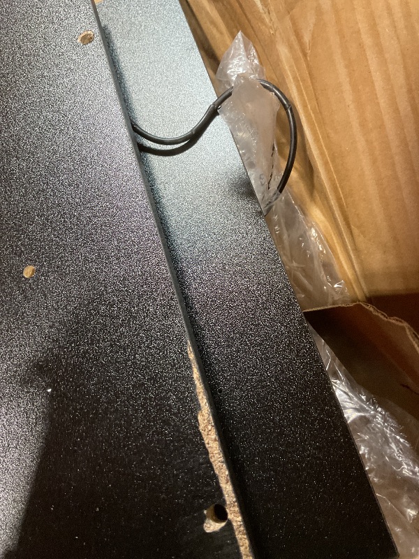 Photo 1 of **SELLING FOR PARTS. CORD DAMAGE. EDGE DAMAGE ON BOARD.**Bed frame with plugin. Size unknown