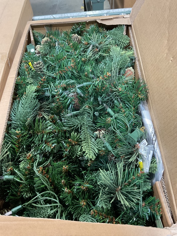 Photo 1 of ***LIGHTS PARTIALLY WORK (HALF ARE FUNCTIONAL & HALF ARE NON-FUNCTIONAL*** National Tree Company 9 ft Pre-Lit Carolina Pine Artificial Christmas Garland, Christmas Decoration with Pinecones, 100 Clear Lights, 240 Tips, Green