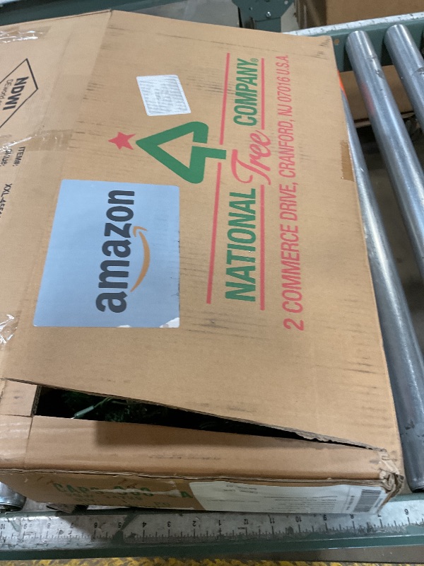 Photo 1 of ***LIGHTS PARTIALLY WORK (HALF ARE FUNCTIONAL & HALF ARE NON-FUNCTIONAL*** National Tree Company 9 ft Pre-Lit Carolina Pine Artificial Christmas Garland, Christmas Decoration with Pinecones, 100 Clear Lights, 240 Tips, Green