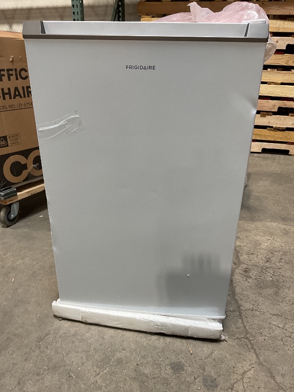 Photo 1 of ***MINOR DAMAGE ***Frigidaire Mini Refrigerator, Compact Freezer Compartment, Adjustable Thermostat Control, Reversible Door, Contemporary Series, 4.5 cu ft, White