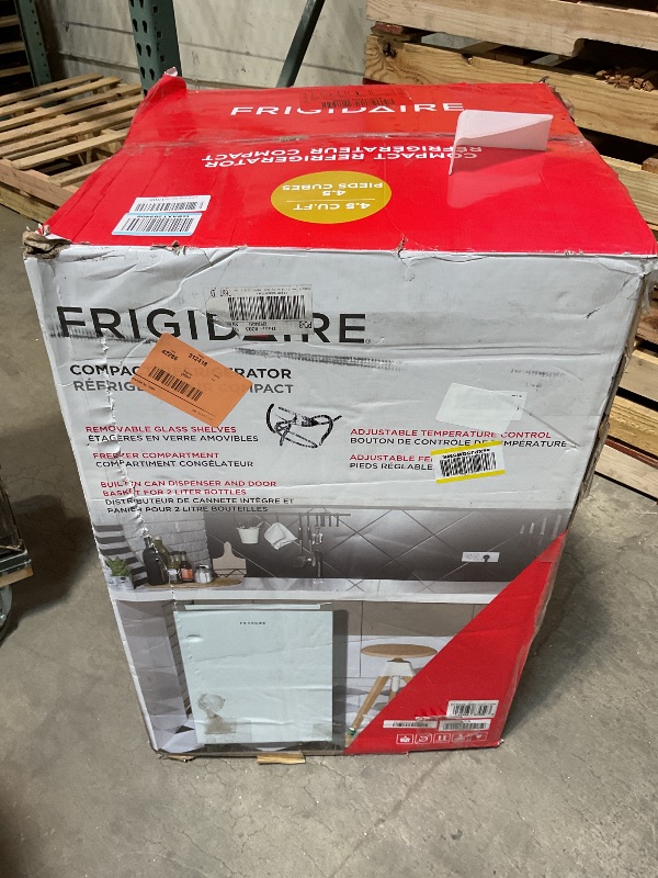 Photo 1 of ***MINOR DAMAGE ***Frigidaire Mini Refrigerator, Compact Freezer Compartment, Adjustable Thermostat Control, Reversible Door, Contemporary Series, 4.5 cu ft, White