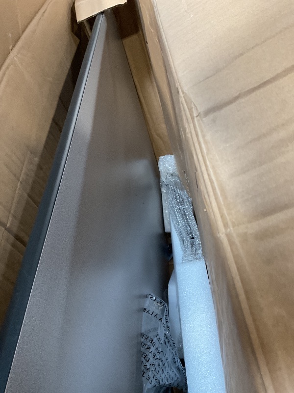 Photo 1 of **DENTS AND SCRATCHES ON FRONT. DAMAGE TO CORNERAmazon Basics Adjustable Rectangular Classroom Activity Table, Writing Desk, Adjustable Height 19-30 Inch, Grey Top/Black Edge, 47" W x 29" L x 30" H