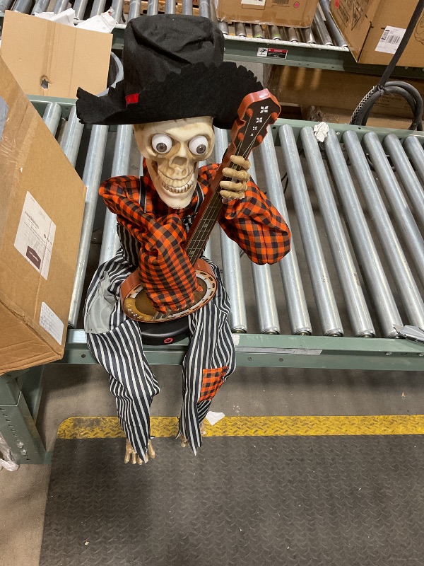 Photo 1 of **NEEDS BATTERIES **Halloween Animatronics Banjo Skeletons Decorations, Animated Skull with Sound Activated, Funny Voice, Light Up Eyes, Playing Musical Halloween Prop Decor for Indoor, Outdoor, Yard Lawn