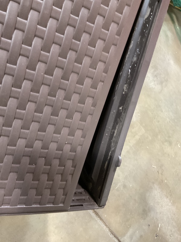 Photo 1 of **BOTTOM IS SCRAPED AND LOOSE. ONE HINGE IS BROKEN**Amazon Basics Outdoor Patio Storage Box 150 Gallon Deck Box, Waterproof and Weather-resistant, Furniture Cushions Garden Tools, Brown