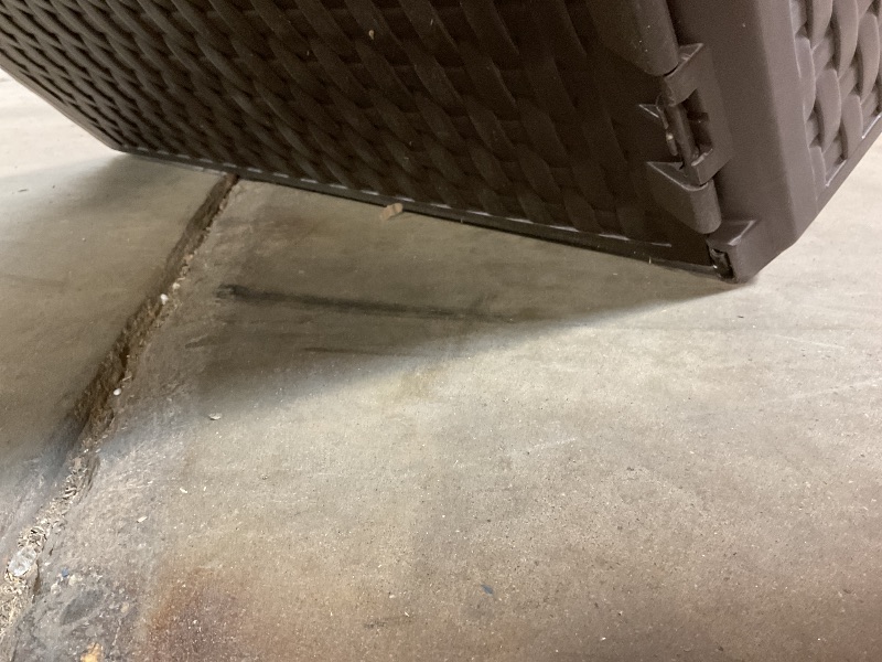 Photo 1 of **BOTTOM IS SCRAPED AND LOOSE. ONE HINGE IS BROKEN**Amazon Basics Outdoor Patio Storage Box 150 Gallon Deck Box, Waterproof and Weather-resistant, Furniture Cushions Garden Tools, Brown