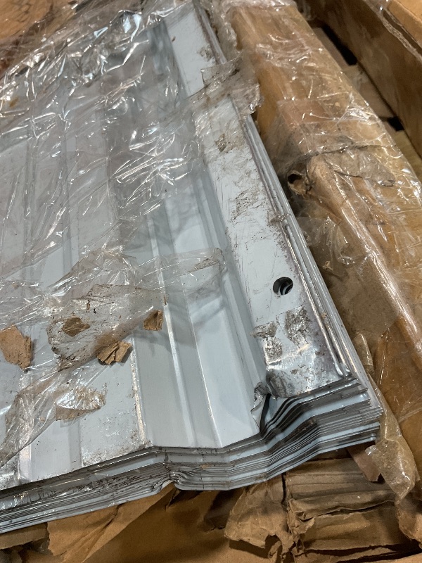 Photo 1 of **BENDS. DIRT**Box of metal siding for carport