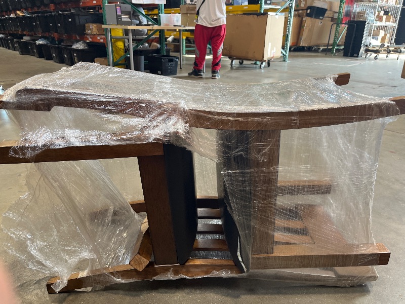 Photo 1 of ** 1Chair has broken leg** 
2 chairs total
Signature Design by Ashley Ralene Rake Back 19" Dining Room Chair 2 Count, Medium Brown