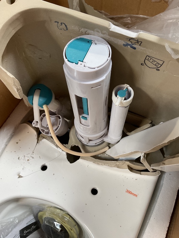 Photo 1 of **SELLING FOR PARTS. MAJOR DAMAGE**Swiss Madison St. Tropez SM-1T251 One-Piece Elongated Toilet 14" Rough-in Vortex Dual-Flush 1.1/1.6 gpf with Comfort Chair Seat ADA Height in Glossy White