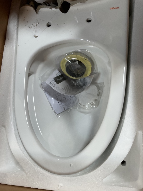 Photo 1 of **SELLING FOR PARTS. MAJOR DAMAGE**Swiss Madison St. Tropez SM-1T251 One-Piece Elongated Toilet 14" Rough-in Vortex Dual-Flush 1.1/1.6 gpf with Comfort Chair Seat ADA Height in Glossy White