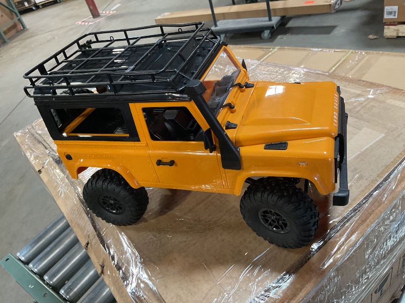 Photo 1 of **missing charging cord and battery**FMTStore MN98 RTR Model 1/12 2.4G 4WD Climbing Rock Crawler Off-Road RC Truck Car Upgrade Parts Land Rover Defender Vehicles Indoor Toys Models for Kids and Adults - Yellow