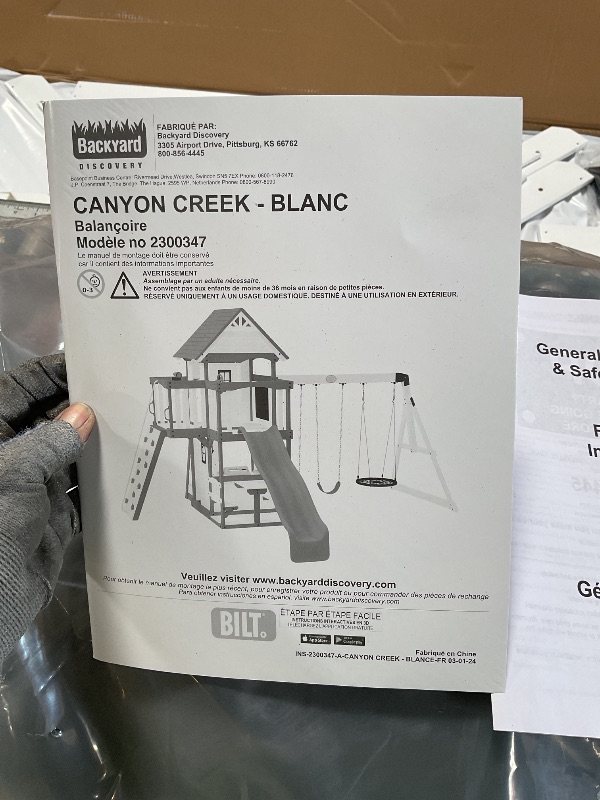Photo 1 of Backyard Discovery Canyon Creek White Cedar Wood Swing Set with Wave Slide, Clubhouse, Play Kitchen, Picnic Area, Belt Swings, Web Swing, Rock Wall, Balconies, Playhouse, Step Ladder, Outdoor Playset