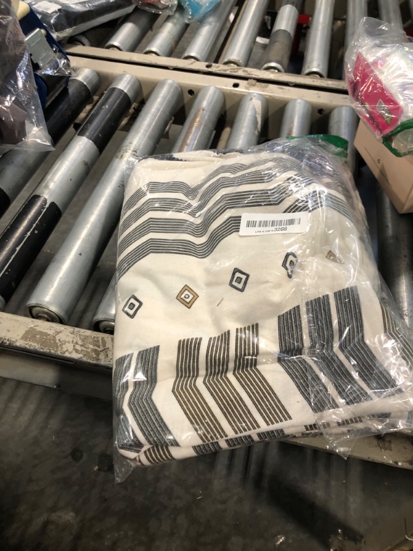 Photo 1 of ColorBird Boho Curtains 2 Panels Geometric Light Filtering Semi-Blackout Window Cotton Linen Patterned Western Curtains with Black Tassel Rod Pocket Drapes for Living Bedroom, 59W x 63L Inch, 1 Pair