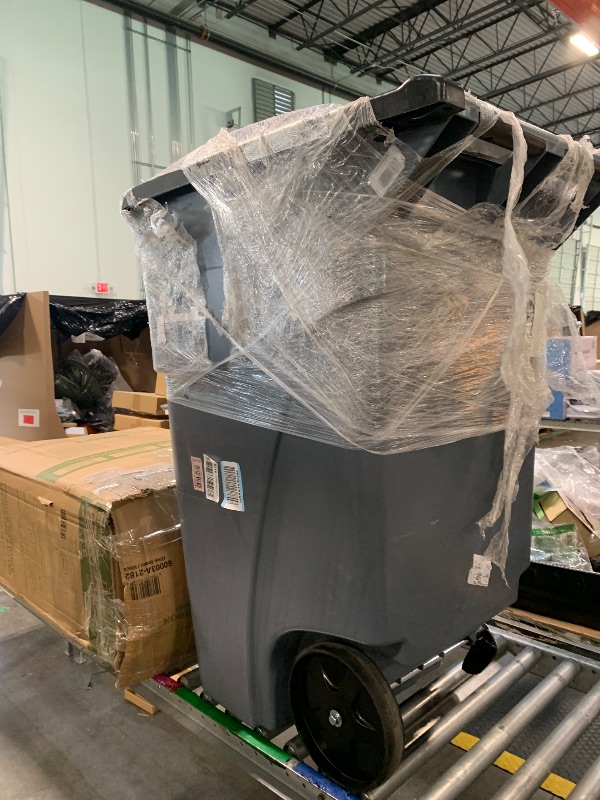Photo 1 of **wheel is damaged **Rubbermaid Commercial Products Brute Rollout Trash/Garbage Can/Bin with Wheels, 50 GAL, for Restaurants/Hospitals/Offices/Back of House/Warehouses/Home, Gray