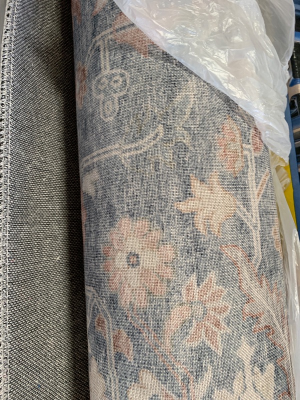 Photo 1 of  living room area rug. Unknown dimensions 