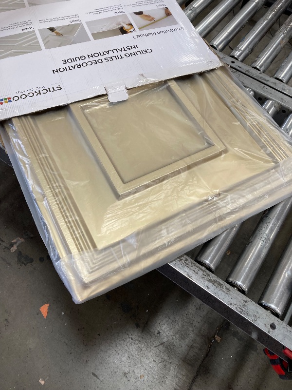 Photo 1 of STICKGOO Glue Up Ceiling Tiles, 24x24 Inch PVC Decorative Drop Ceiling Tile Champaign Gold 48 Sq. Ft, Pack of 12 Tiles