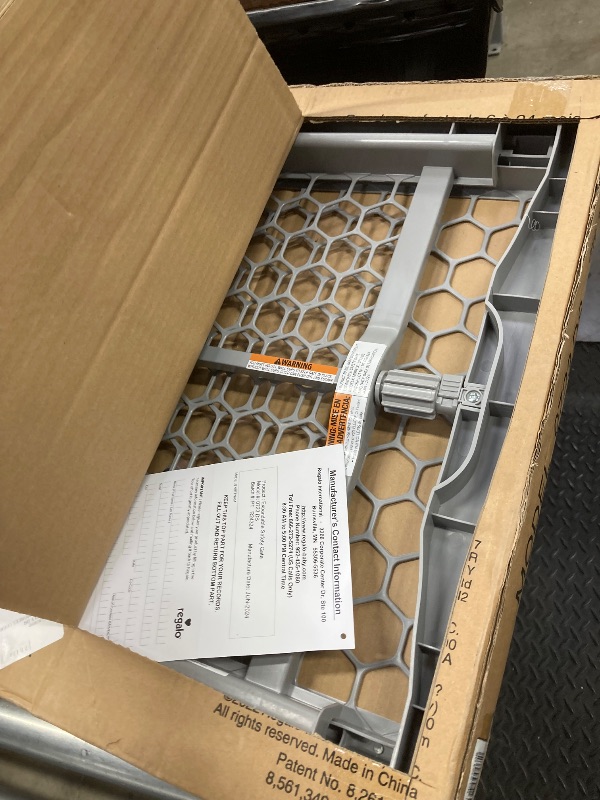 Photo 1 of Regalo Easy Fit Plastic Adjustable Extra Wide Baby Gate, 1 Count (Pack of 1)