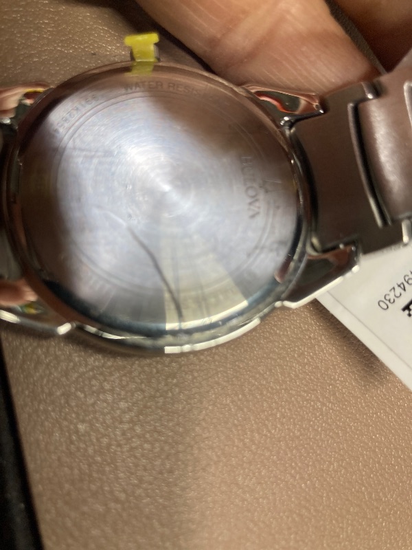 Photo 1 of ***FACE AND BAND HAVE MANY SCRATCHES*** Bulova Men's 3-Hand Calendar Date Quartz Watch, Patterned Dial, 38mm, Style: 96B149
