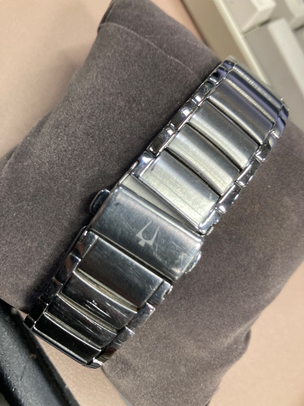 Photo 1 of ***FACE AND BAND HAVE MANY SCRATCHES*** Bulova Men's 3-Hand Calendar Date Quartz Watch, Patterned Dial, 38mm, Style: 96B149
