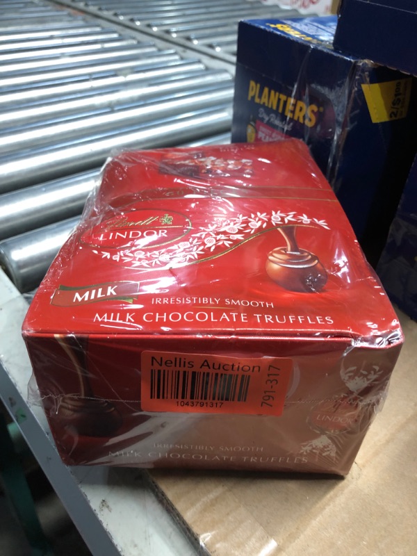 Photo 1 of ***(EXP: 7/31/25)NONREFUNDABLE*** Lindt LINDOR Milk Chocolate Candy Truffles, Milk Chocolate with Smooth, Melting Truffle Center, 25.4 oz., 60 Count