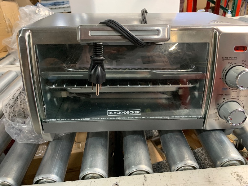 Photo 1 of ***(HEAVILY USED/ MINOR DAMAGE)***
BLACK+DECKER Crisp 'N Bake Air Fry Countertop Convection Toaster Oven, Medium Capacity, 4-Slice, 5-in-1, Fits 9” Pizza, 30-Min Timer, Bake, Broil, Air Fry, Toast, Keep Warm, Stainless Steel