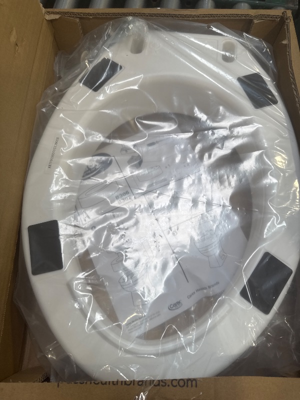 Photo 1 of Carex Toilet Seat Riser, Elongated Raised Toilet Seat Adds 3.5 inches to Toilet Height, for Assistance Bending or Sitting, 300 Pound Weight Capacity Toilet Riser