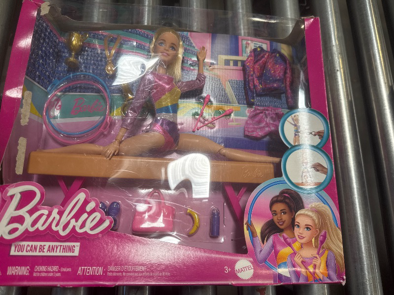 Photo 1 of Barbie Careers Playset, Gymnastics Set with Blonde Gymnast Fashion Doll, C-Clip for Flipping Action, Balance Beam, Warm-Up Suit & Accessories
