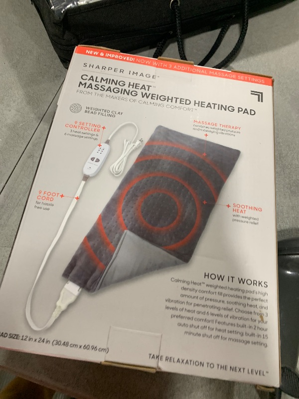 Photo 1 of Calming Heat Massaging Weighted Heating Pad by Sharper Image- Weighted Electric Heating Pad with Massaging Vibrations, 9 Settings- 3 Heat, 6 Massage- 18 Relaxing Combinations, 12” x 24”, 4 lbs