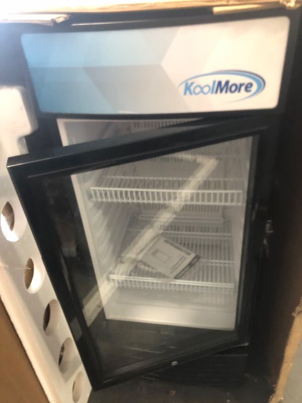 Photo 1 of **Minor dent on back left corner of fridge**
KoolMore KM-MDR-1D-6C 6 Cu. Ft. Commercial One Glass Door Display Upright Beverage Refrigerator Cooler Merchandiser-22.8 in. x 21.4 in. x 52.7 in. [Black]